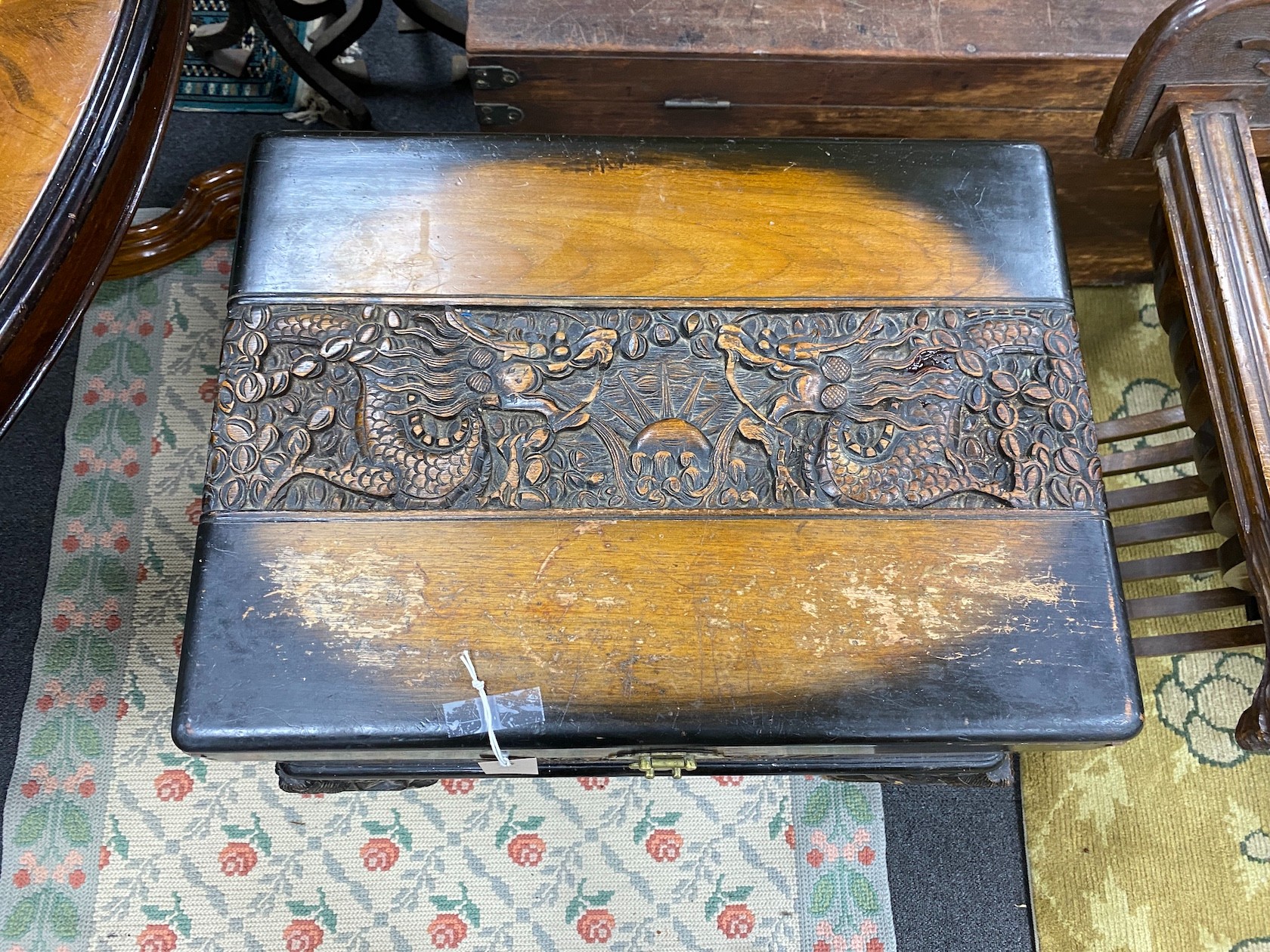 A Chinese carved camphorwood work box, width 60cm, depth 46cm, height 67cm
